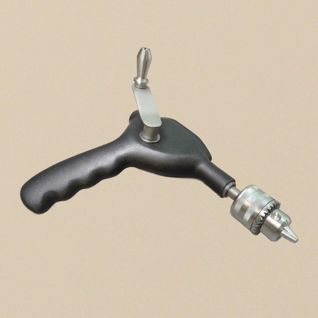 Ralk bone hand drill with chuck key, shown in its open storage case.