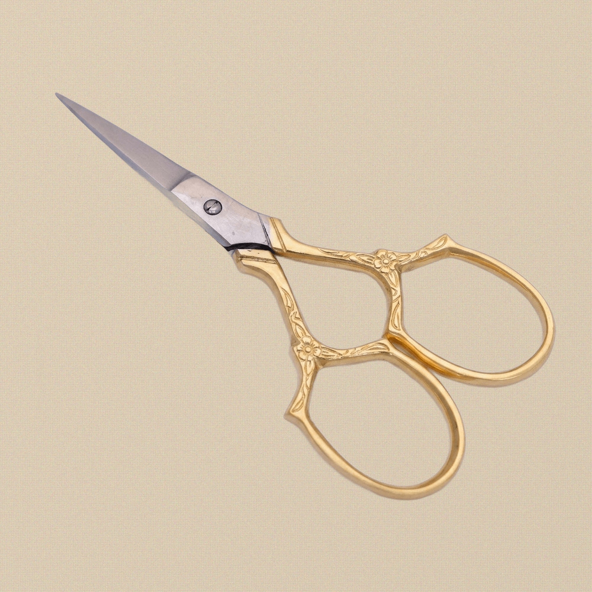 Gold-plated embroidery scissors with ornate floral pattern handles, 3.5-inch length, on a white background.