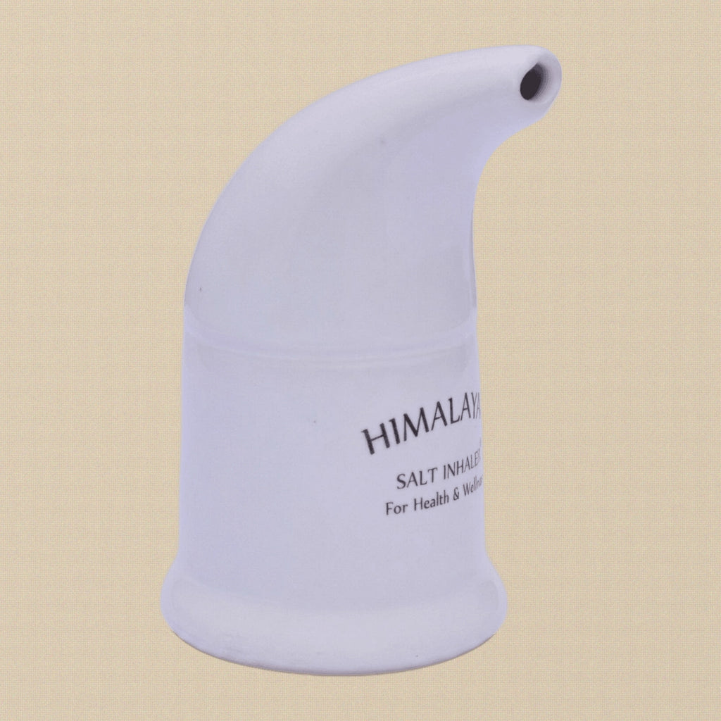 The ceramic inhaler shown next to its included packet of Himalayan salt.