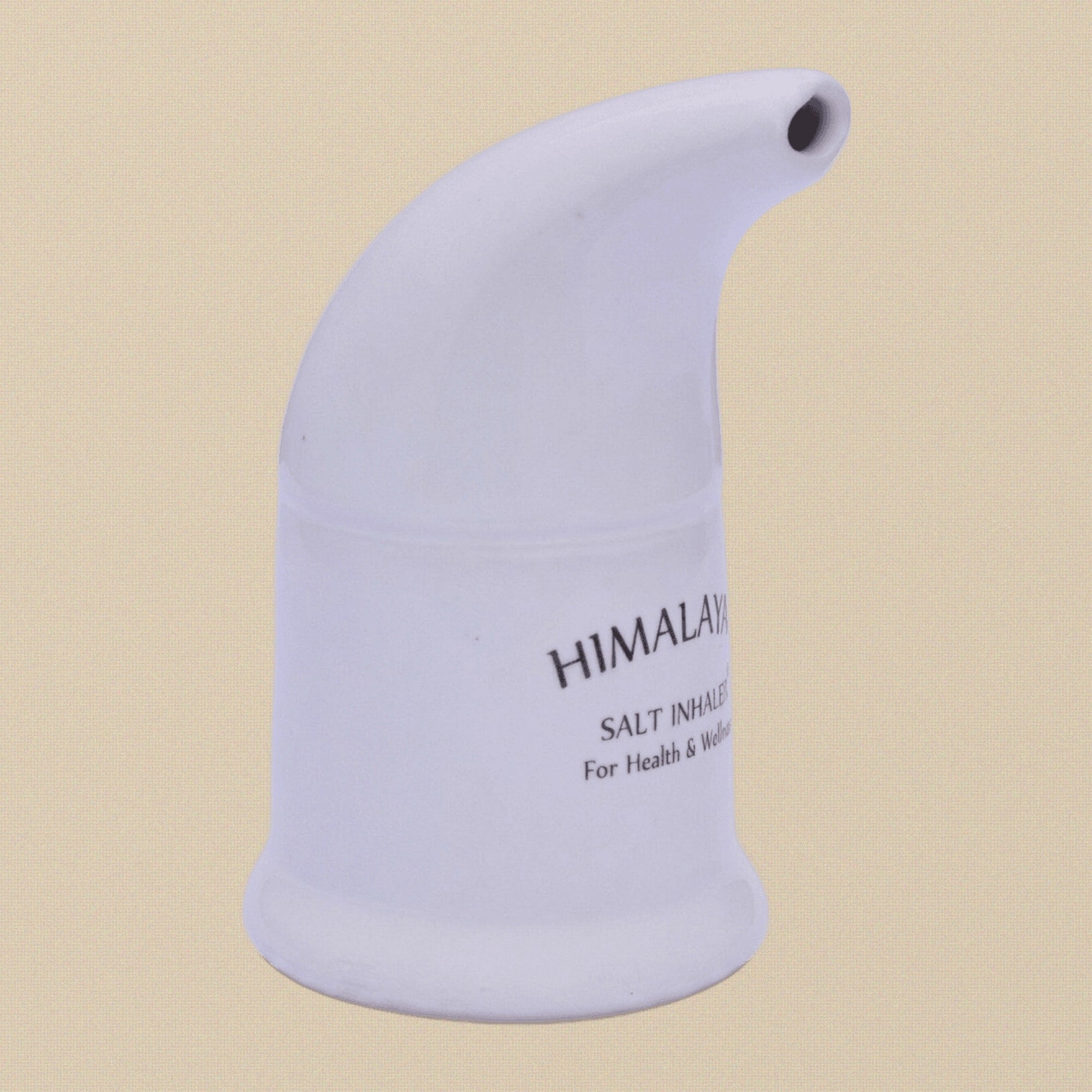 The ceramic inhaler shown next to its included packet of Himalayan salt.