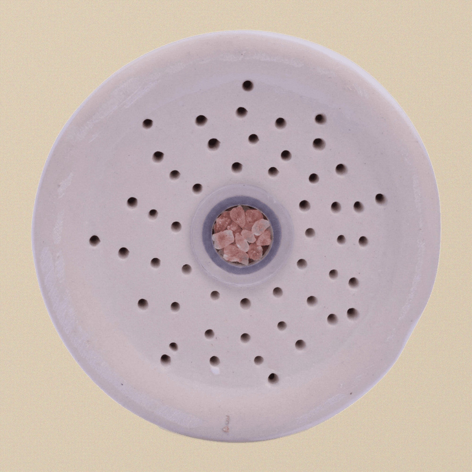 View of the base of the inhaler showing the plug for refilling salt.