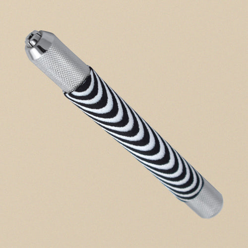Bead reamer handle with a zebra-stripe foam grip and knurled collet chuck, standing at an angle