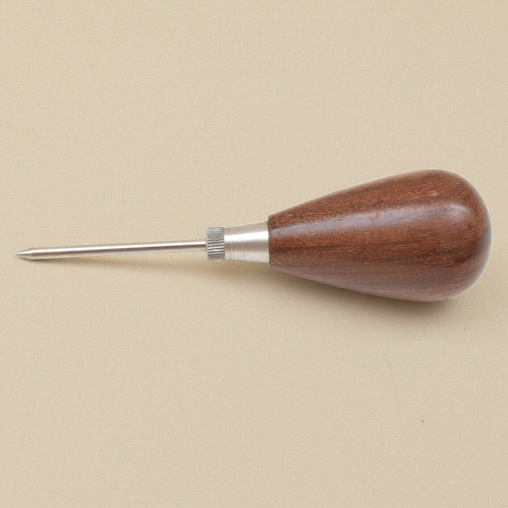 Scratch awl lying flat, point to the left