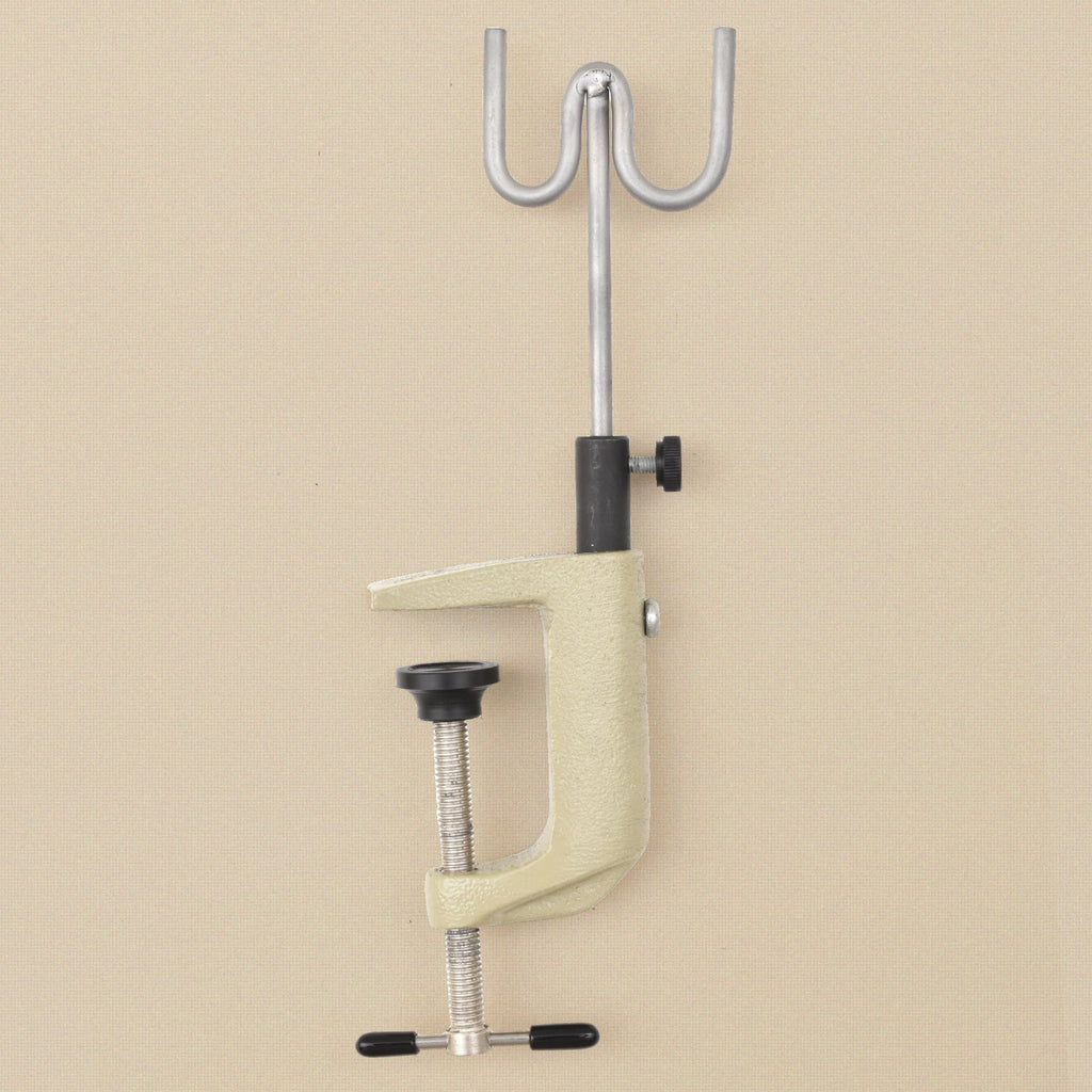 Bench clamp torch holder standing upright showing the clamp jaw and fork