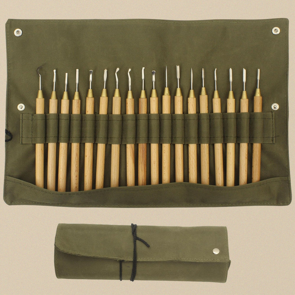 Canvas roll open and rolled, showing the eighteen wooden-handled carvers