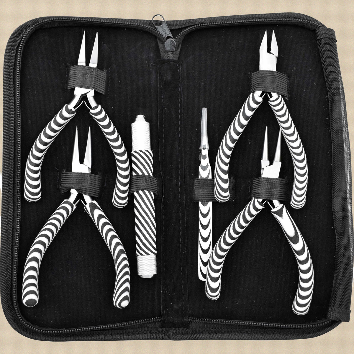 The six zebra-grip tools in their black zip case